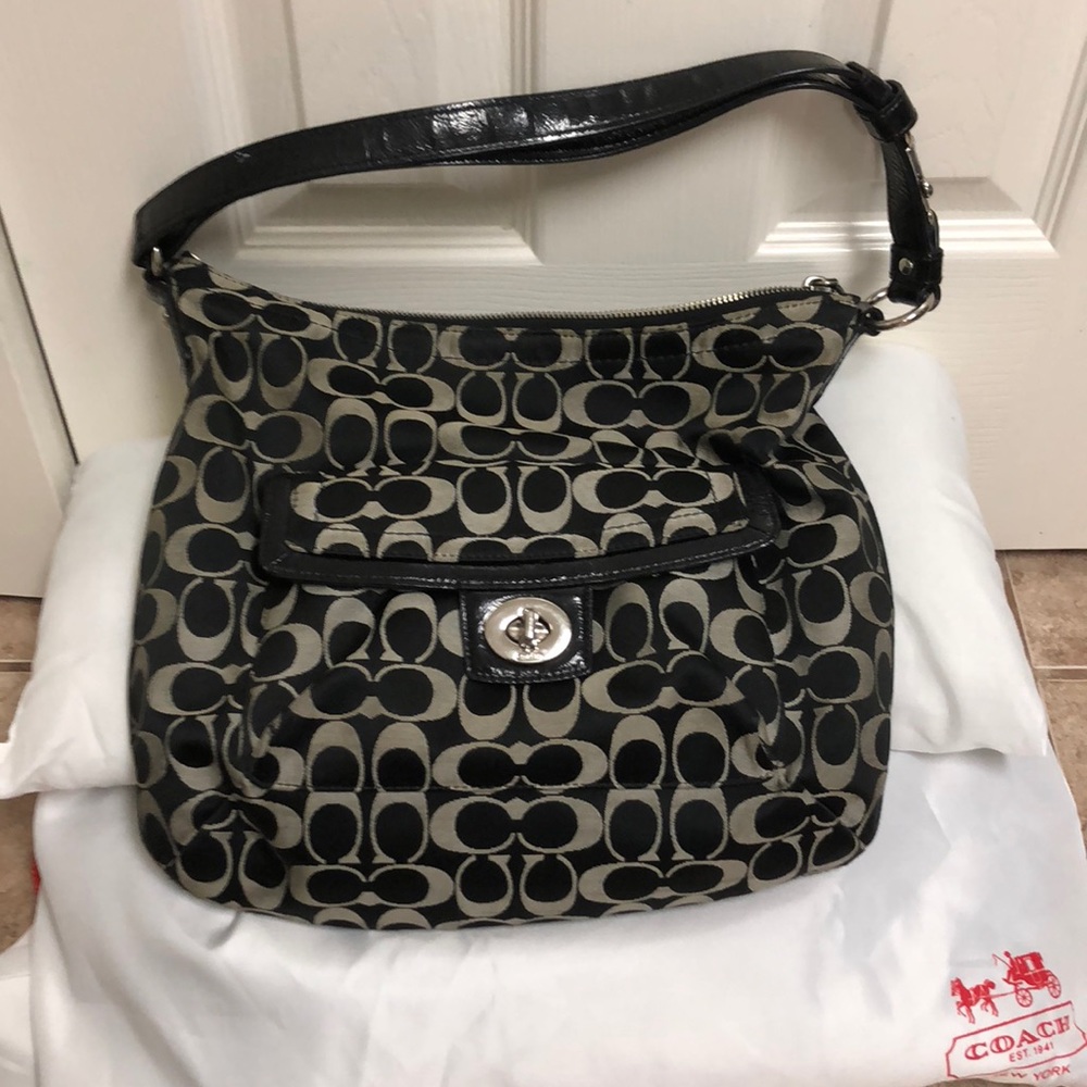 Black and gray Coach C patterned purse